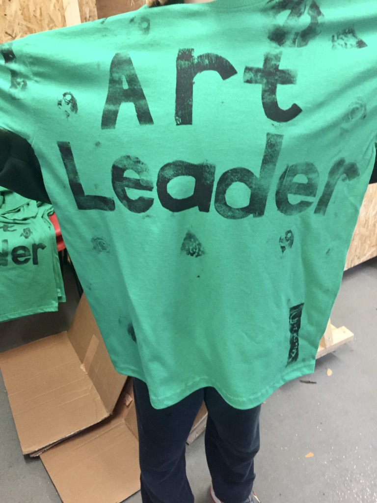 Art leader t-shirt. Screen print. Green shirt, black letters
