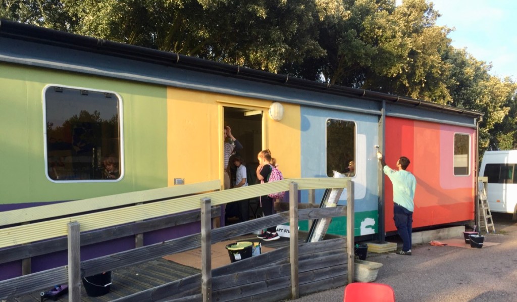 Palm Bat arts studio cabin - painted in bright colours and bold geometric designs